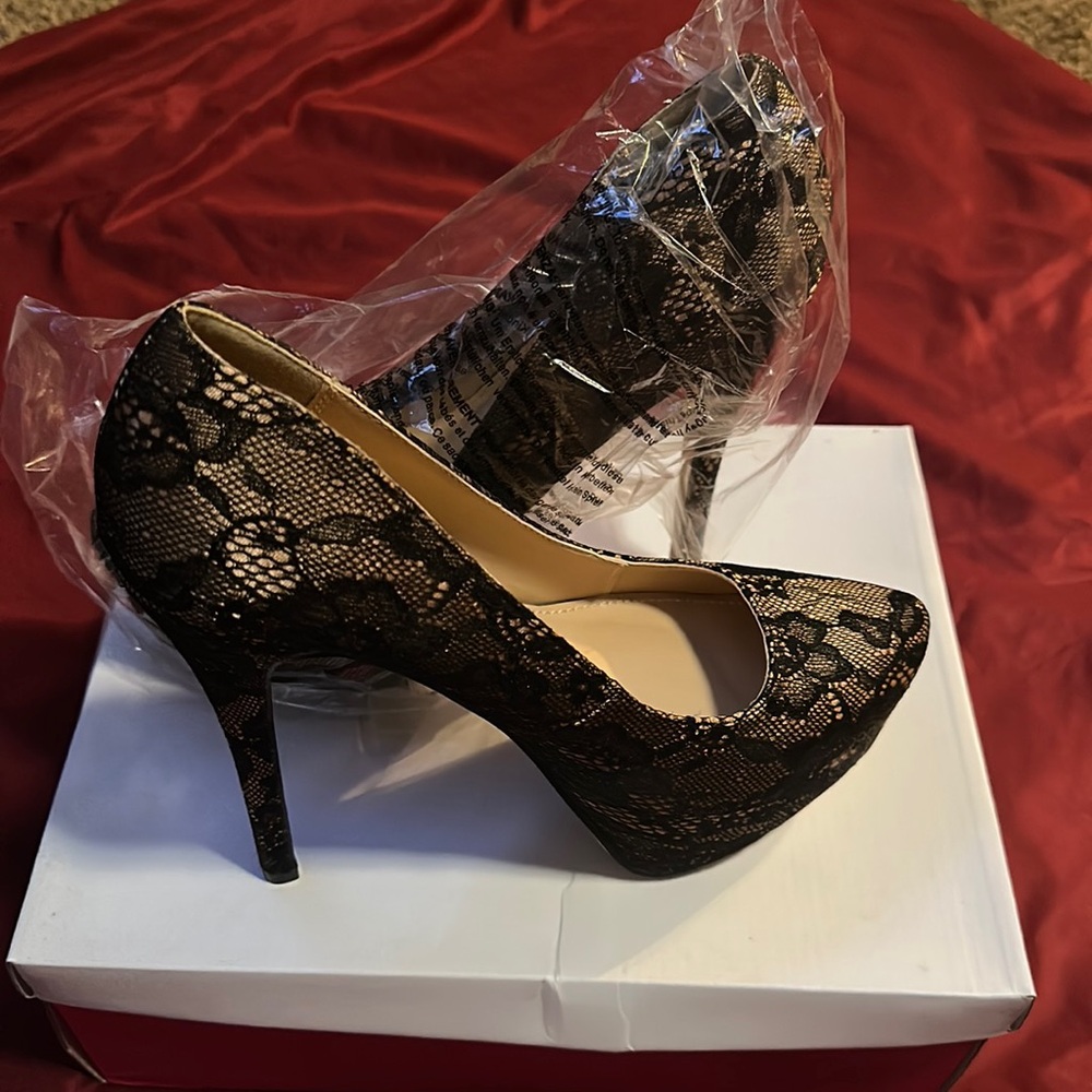 Never been worn Lace Heels.